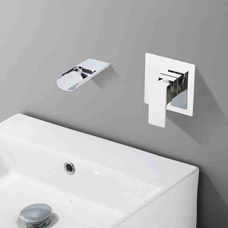 The wall mounted basin in the bathroom has a concealed embedded faucet